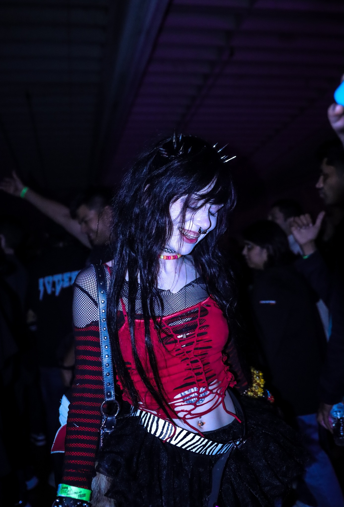 Neon-lit warehouse atmosphere at Planet Rave Y2K25 San Diego