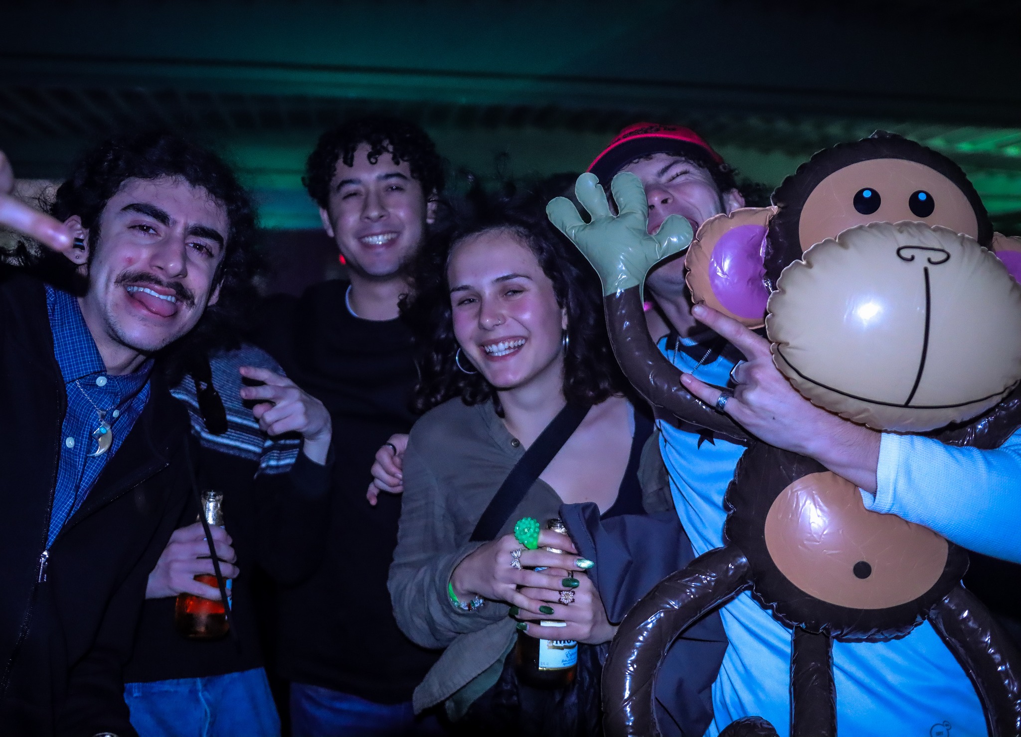 Cyan and pink light beams crossing the venue at San Diego rave
