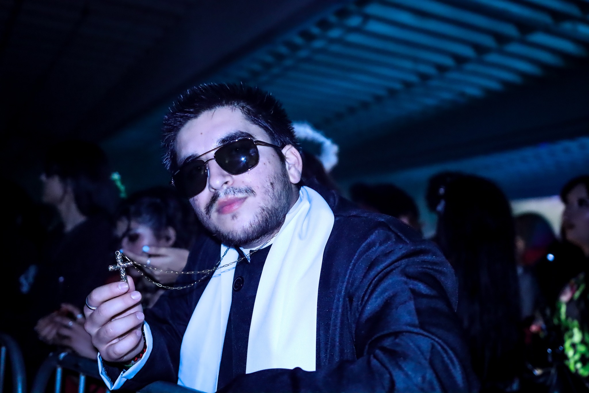 Packed dance floor at Planet Rave Y2K25 warehouse event